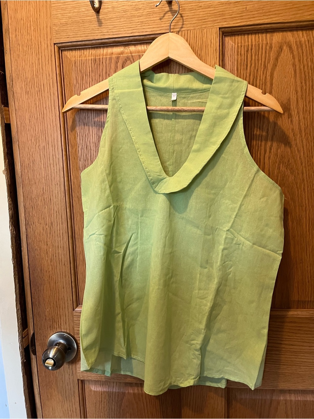 Light Green Sleeveless V-Neck Women's Top and pants.